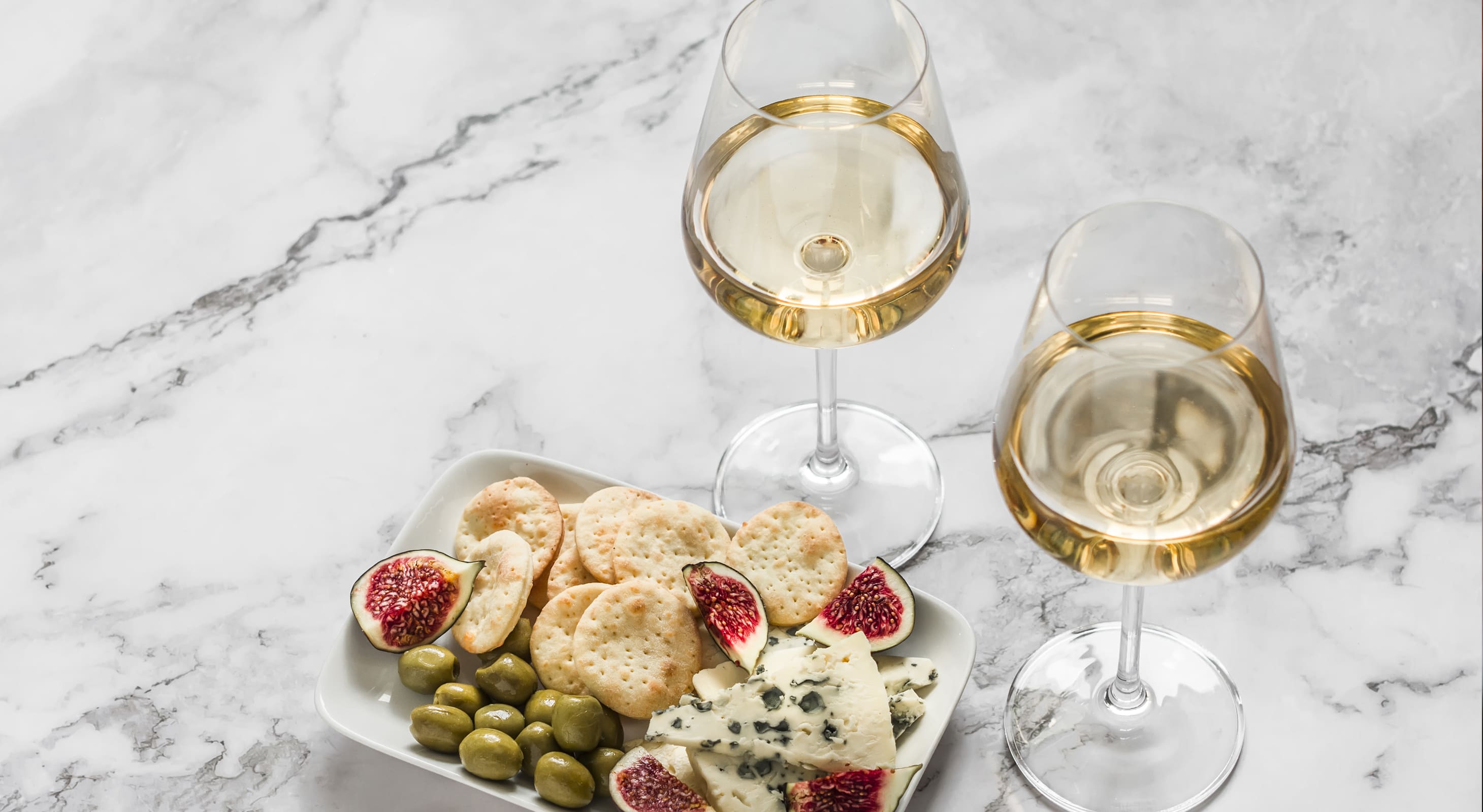 white wine and cheese plate at the oaks