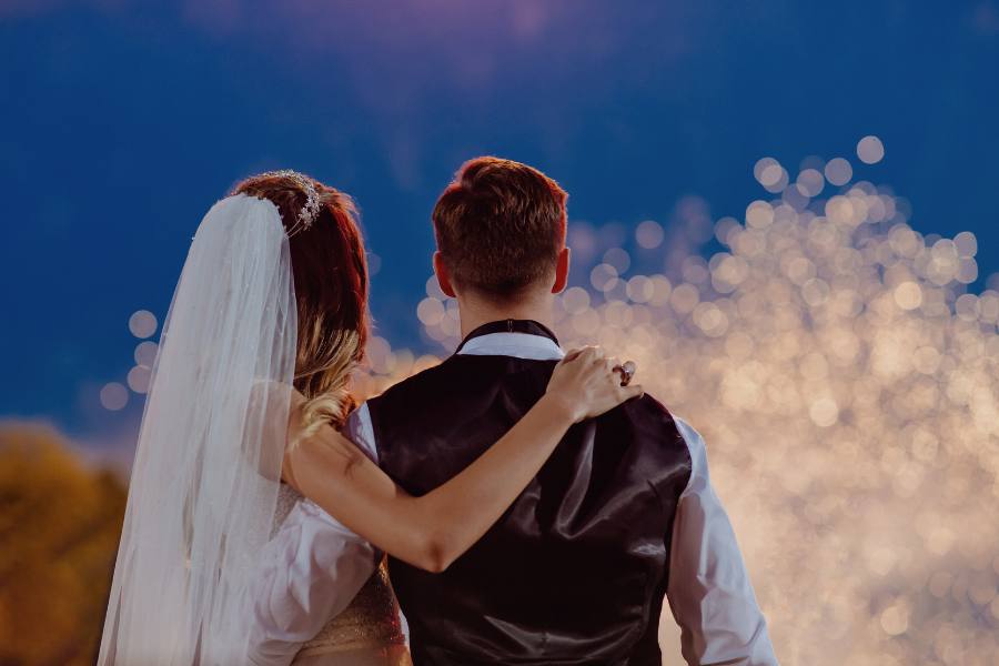 Married couple looking at fireworks
